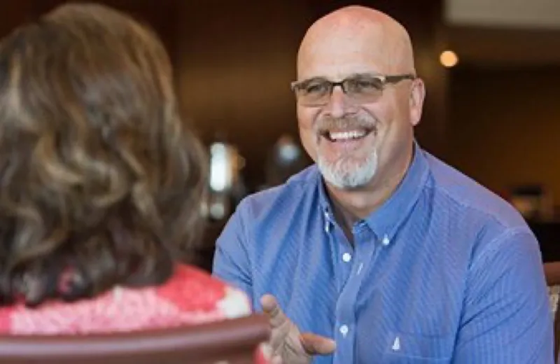 Dan McArthur in a one-on-one coaching conversation