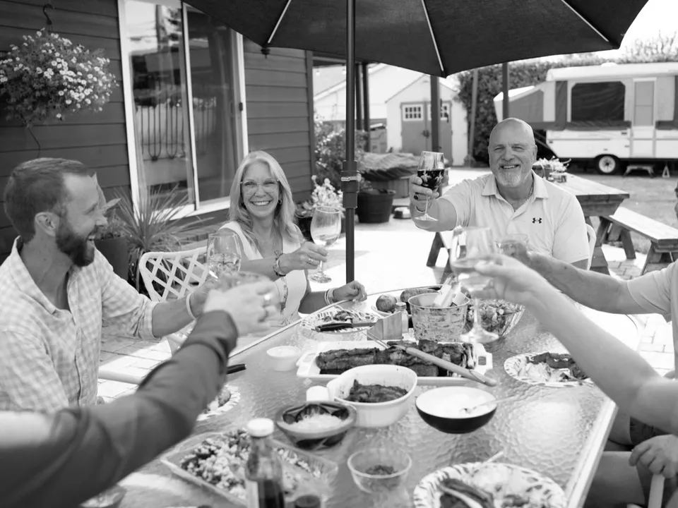 A leadership team sharing a meal around a table